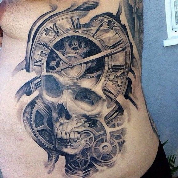 Skull tattoo and clock mechanisms tattoo on ribs by Josh Duffy